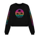 Front view of a black crew neck sweater with very bright rainbow colored Circle logo with black palm trees and the words Hyperlite Wake below that image. On the sleeves, the words Hyperlite Wake CO on the right arm and Forever Wakes & Sunshine on the left arm.