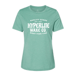 Front view of green womens t-shirt with a large white logo that states Quality Goods, EST 1991, Hyperlite Wake CO., Don't fear time on the center of the chest.