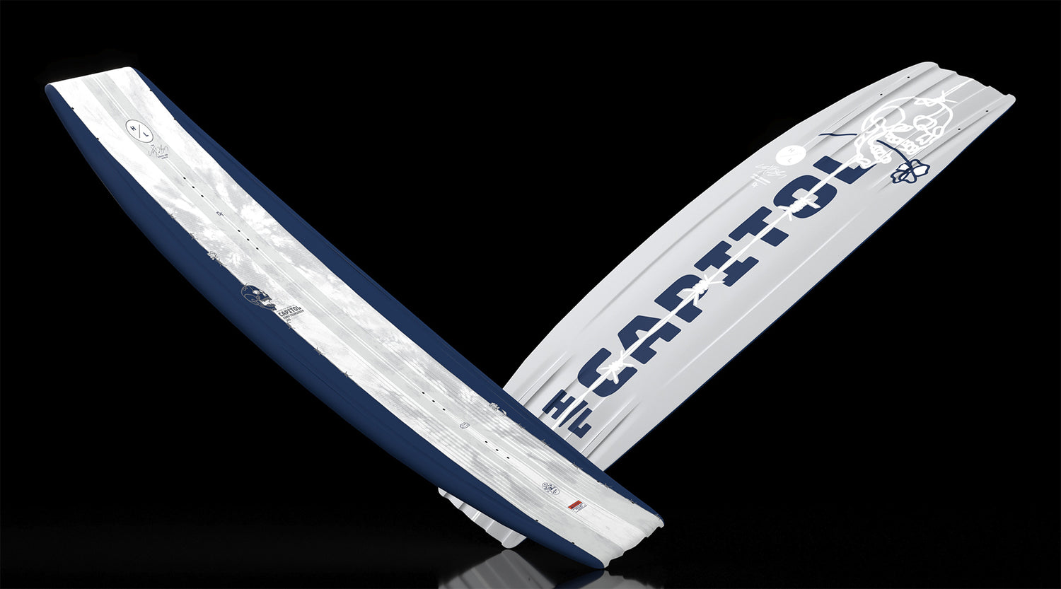 Angled view of Capitol wakeboard with navy sides and bold gray base design.