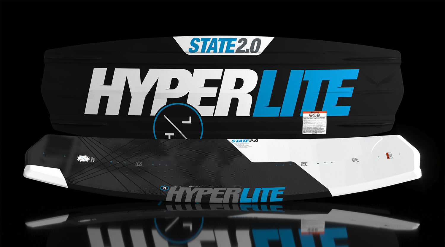 Side view of State Jr. wakeboard in black and white with blue accents.