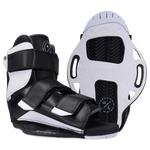 Sender boots with textured soles and adjustable straps, in black and white.