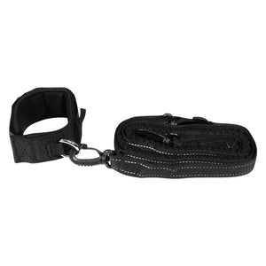 Side view of the iSUP Ankle Leash with padded ankle cuff and coiled black leash.