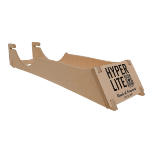 Wooden sled, Hyper Lite on side, displayed on a Foil Display Stand.