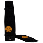 Vertical view of one black foil board foot strap standing upright beside another lying flat.