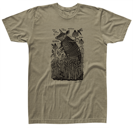 Guara Tee: Tan T-shirt with an armadillo design in a cotton/poly blend.