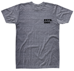 Front view of gray t-shirt with black logo saying ESTD. 1991 and a small circle H/L Logo on the left chest.