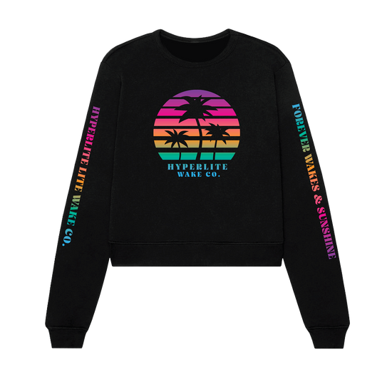 Front view of a black crew neck sweater with very bright rainbow colored Circle logo with black palm trees and the words Hyperlite Wake below that image. On the sleeves, the words Hyperlite Wake CO on the right arm and Forever Wakes & Sunshine on the left arm.