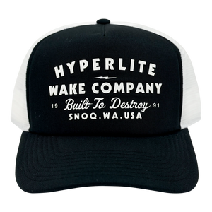 Front view of the Harley Trucker Hat with bold white text graphic on the black crown.