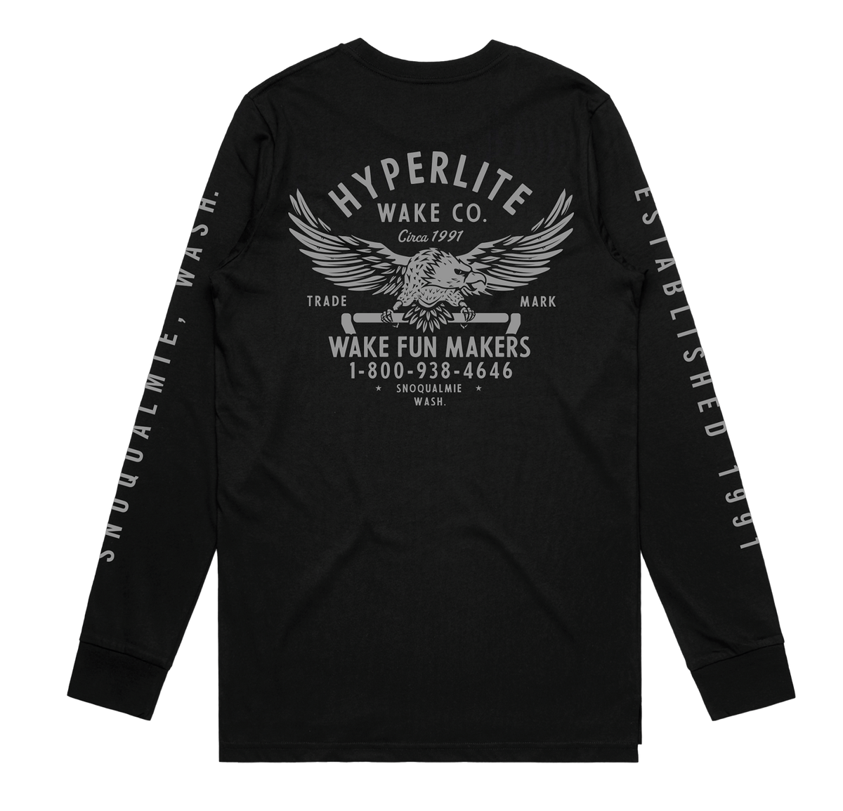 Back view of a black long-sleeve shirt featuring a large graphic of an eagle holding a wakeboard handle with text reading 'Hyperlite Wake Co. Wake Fun Makers, 1-800-938-4646, Snoqualmie, Wash.' Sleeves have 'Snoqualmie, Wash.' and 'Established 1991' printed in gray.