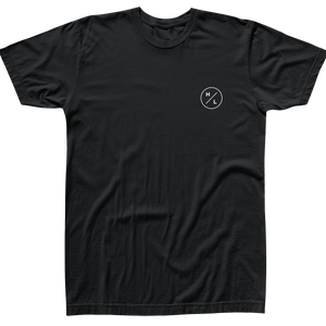 Front view of the black Shop T with a small white HL circle logo on the left chest.