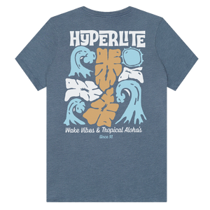 Back view of the Women's Tropics T with tropical floral and wave graphics and stylized text.