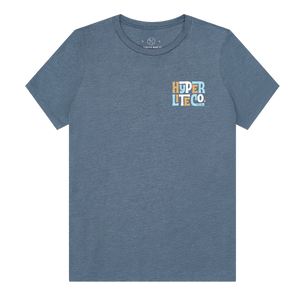 Front view of the Women's Tropics T in denim blue with a small multicolor chest logo.