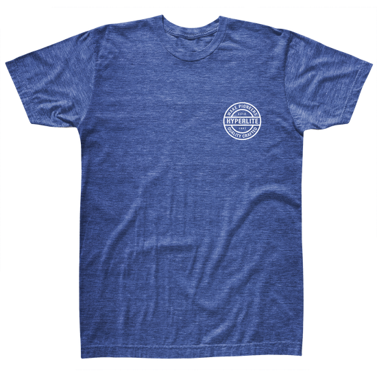 Front view of a blue t-shirt with a white circle logo on the left chest that says Hyperlite, Wake Pioneers, Quality crafted, EST 1991.