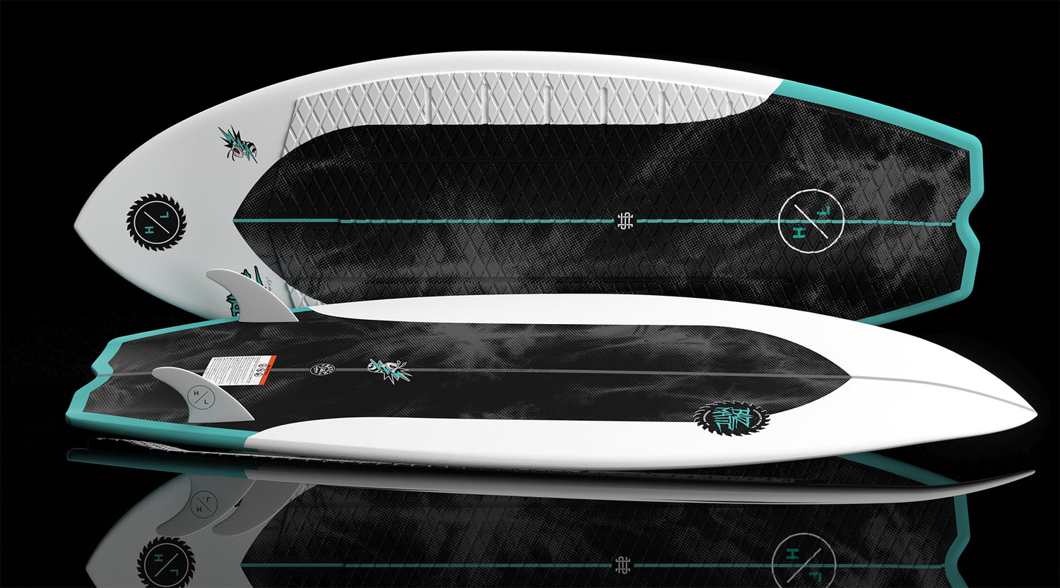 Angled pair of Buzzmatic boards, one top up with pad, one base up with graphic.