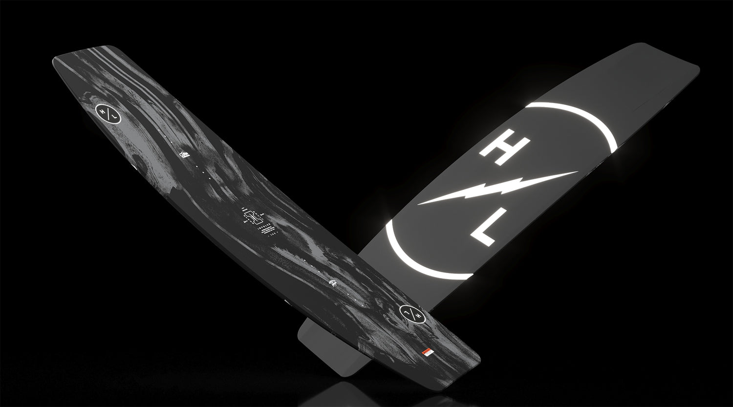 Angled side view of Impulse board with swirling black marbled top and HL lightning logo.