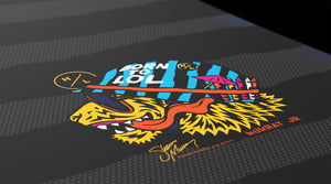 Detail view of Murray Jr. Boys wakeboard lion graphic with 'Born to LOL' helmet text.
