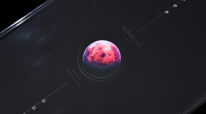 Close-up of pink planet graphic detail on the black deck of the Pleasure wakeboard.