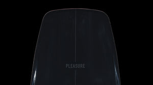 Close-up of the Pleasure wakeboard nose showing subtle centerline and glossy black finish.