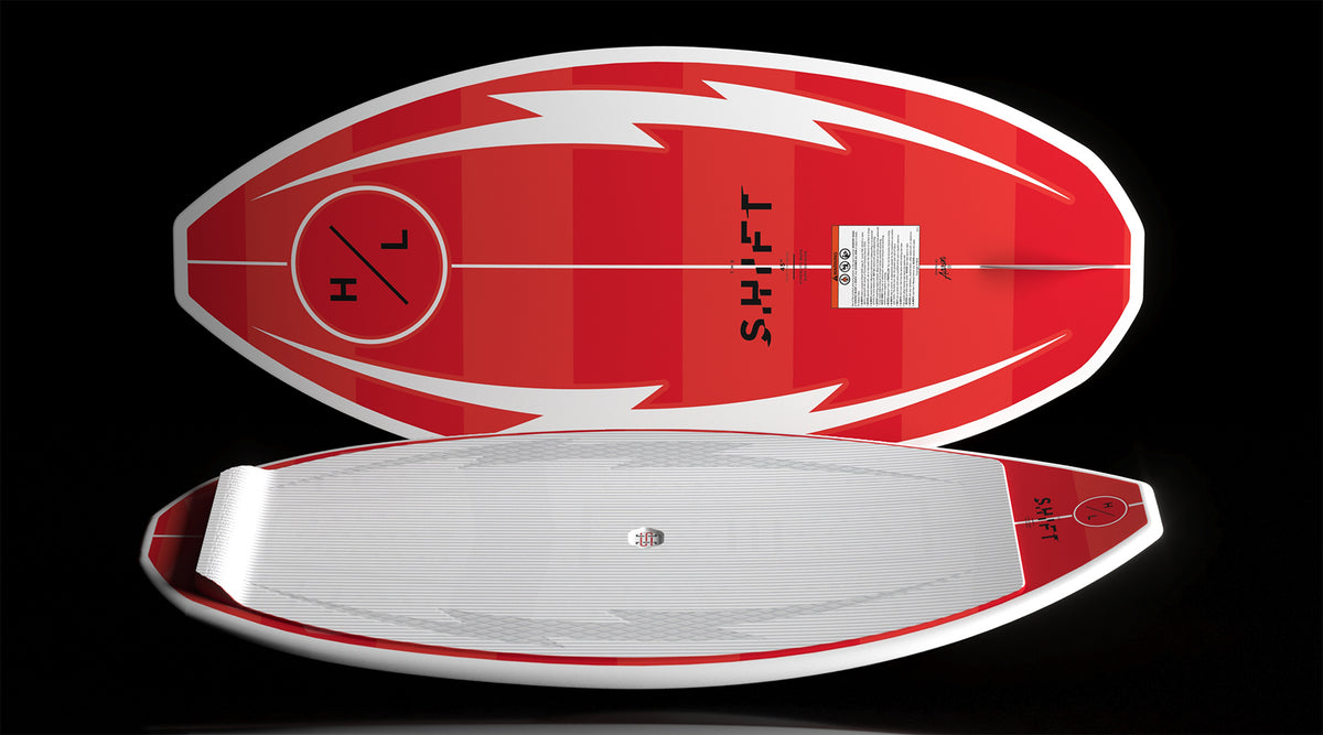 Angled pair of Shift boards, one top up with pad, one base up with graphic.