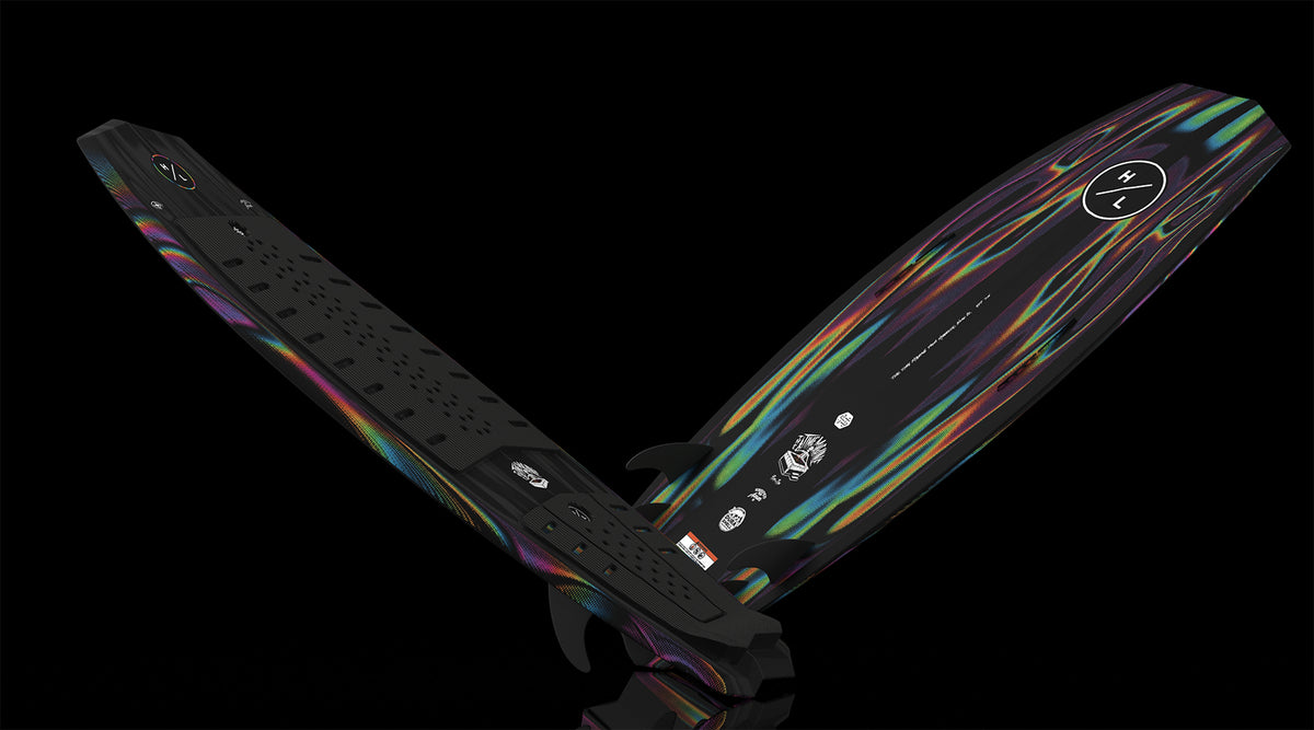 Angled view of Time Machine board showing black deck, pad and multicolor abstract base.