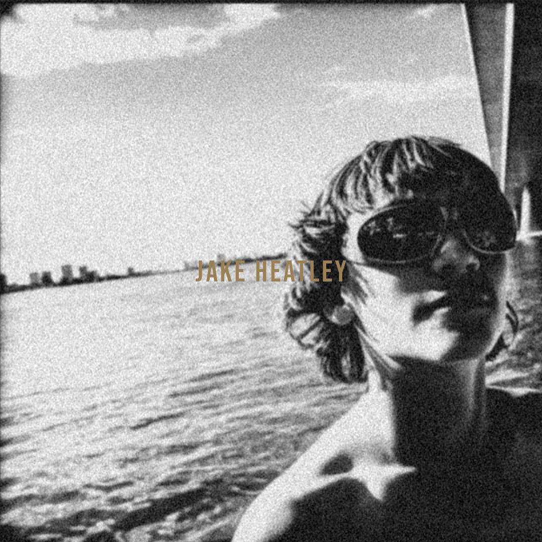 Black and white blurred photo of athlete Jake Healey wearing sunglasses on the water