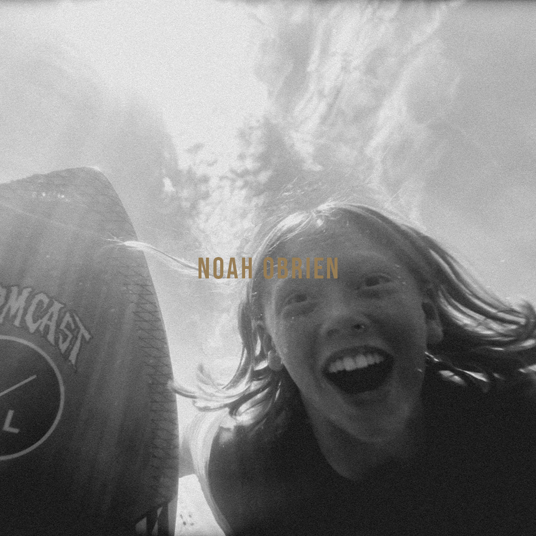 Black and white portrait of Hyperlite pro rider Noah Obrien smiling under water.