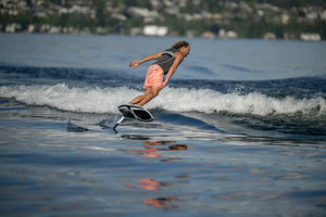Person riding a Starship w/Falcon Foil Kit on a calm lake.