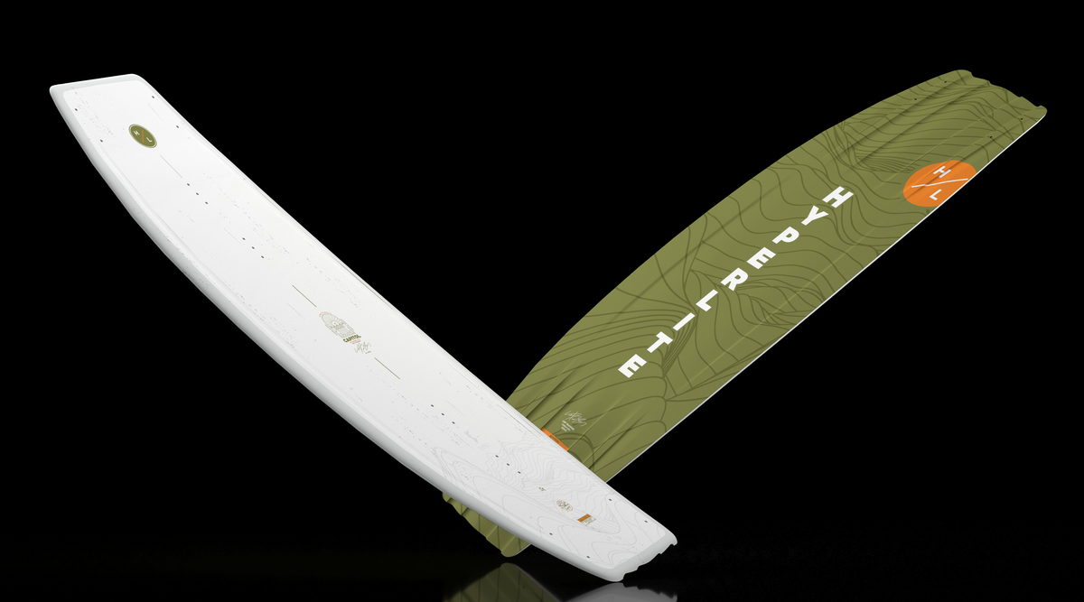 Angled view of white and green Capitol wakeboard showing both sides.