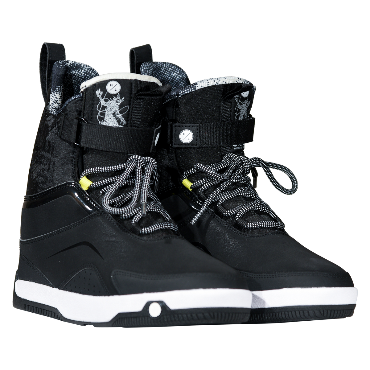 Angled view of a pair of black Gooey Boots with creature-graphic tongues, ankle straps, and yellow loops.