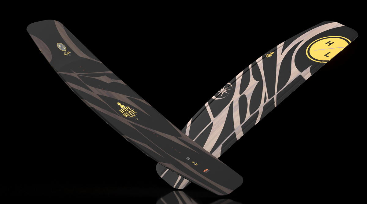 Angled view of two crossed Guara wakeboards with a black top and yellow H/L base.