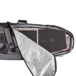 Snowboard partly visible in an open Team Bag with a padded shoulder strap.