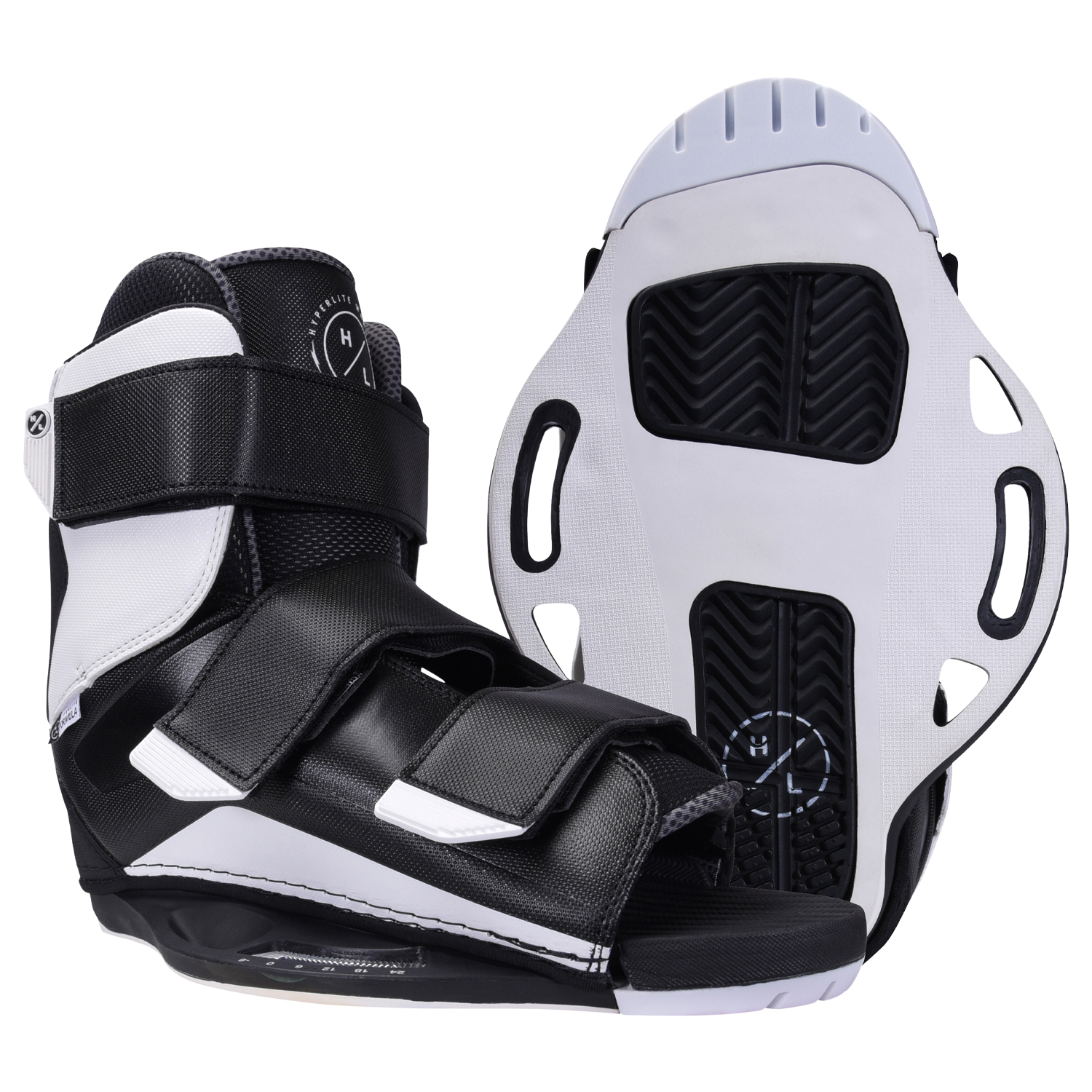 Sender boots with textured soles and adjustable straps, in black and white.