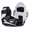 Sender boots with textured soles and adjustable straps, in black and white.