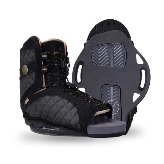 Side and base views of the black Syn Binding with quilted gray panels, gold-flecked laces, and an open toe.