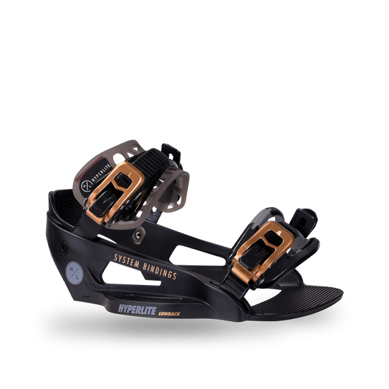 Side view of the black System Lowback binding with gold buckles on smoke-gray ankle and black toe straps.