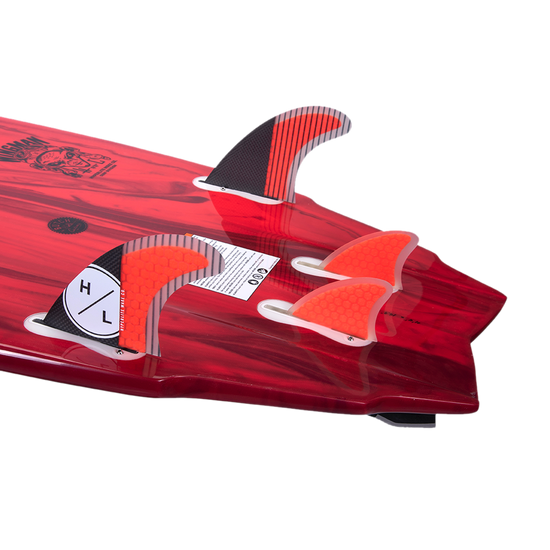 Red surfboard tail with a Wingman 4 Fin Set and key.